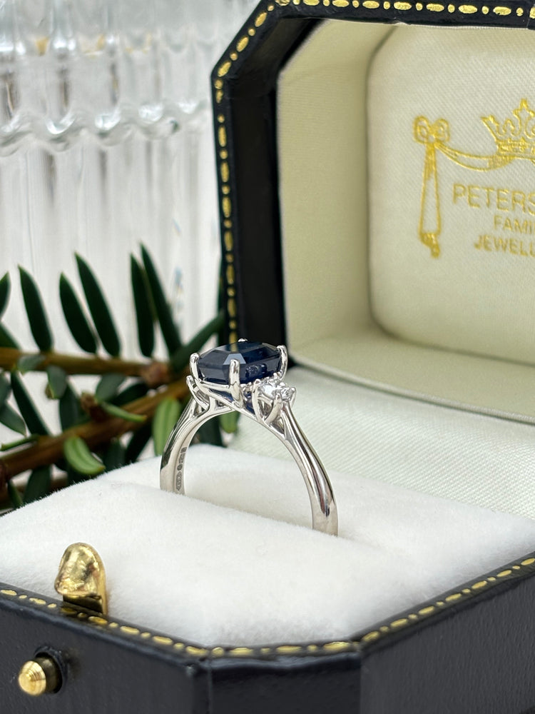 Platinum Blue Sapphire and Diamond Three Stone Ring.