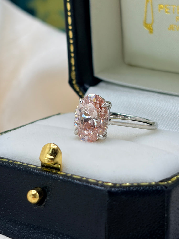 Oval pink diamond solitaire ring in platinum