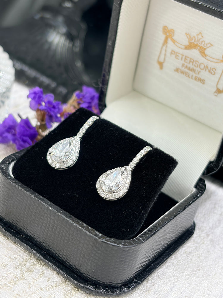 Pear cut diamond halo drop earrings in a Petersons Family Jewellers box