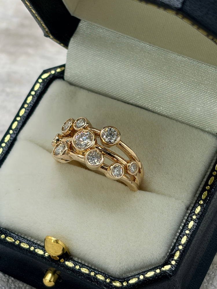 Gold and diamond bubble ring in a Petersons presentation box