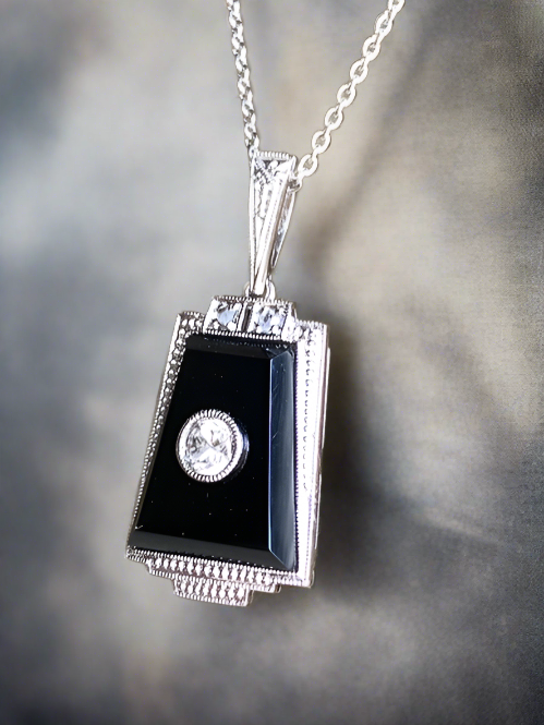 Antique Onyx and Diamond Art Deco Pendant.